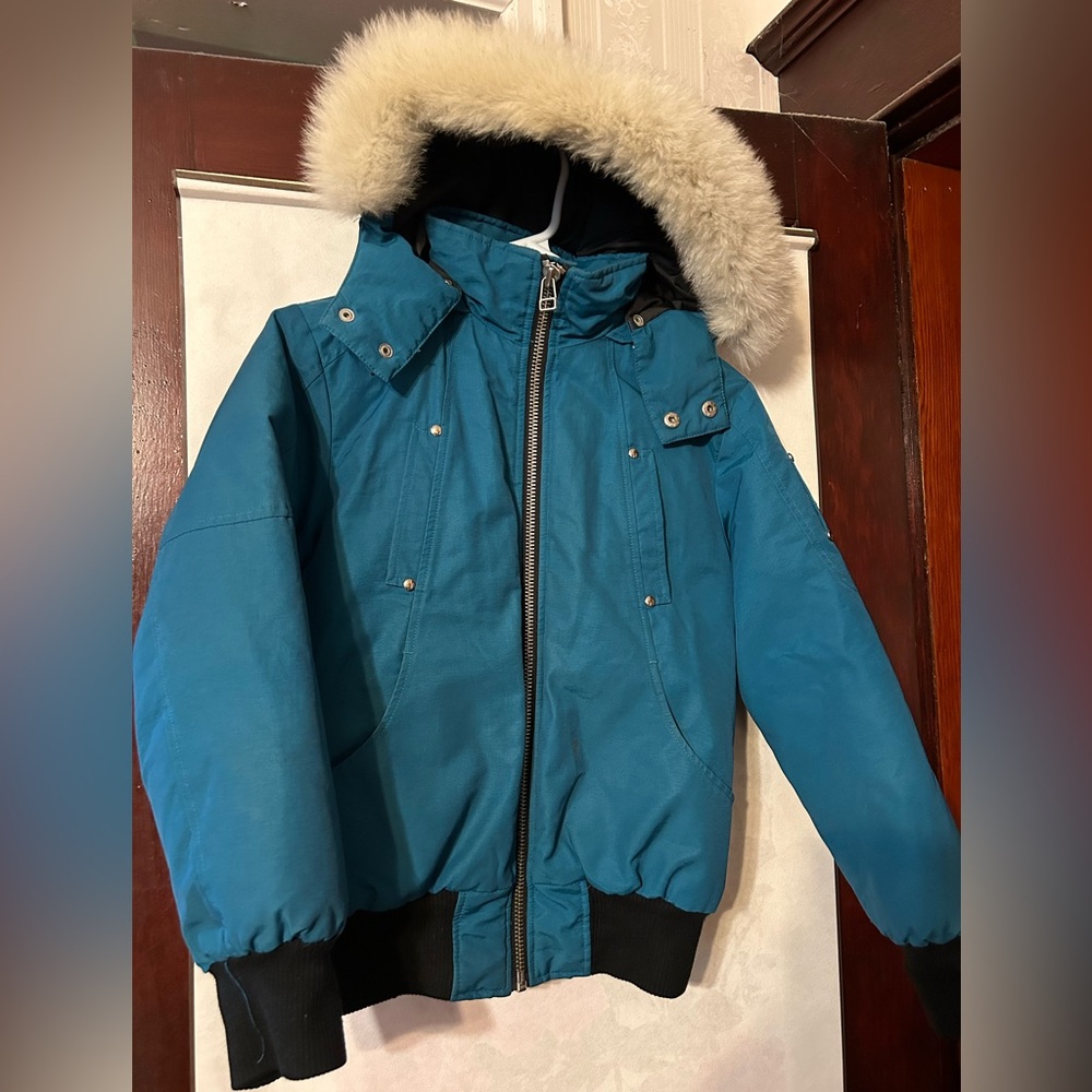 Moose Knuckles girl’s bomber Parka teal color, size medium
